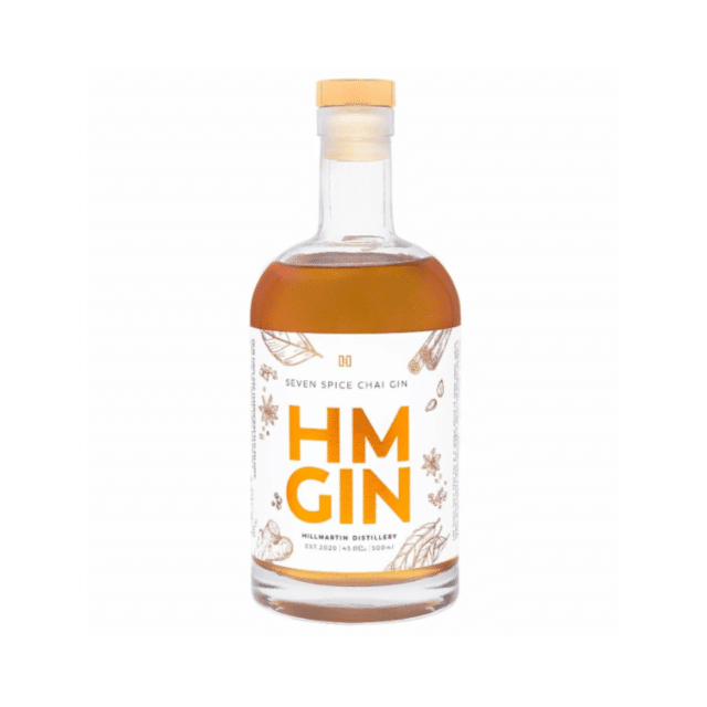 A bottle of Hillmartin Distillery's HM Seven Spice Chai Gin, rich with aromatic spices.