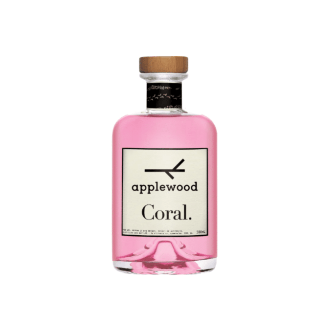 A bottle of Applewood Distillery Coral Gin surrounded by coastal elements.