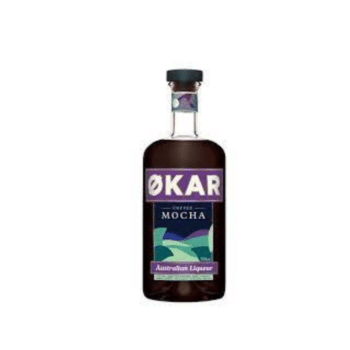 Bottle of Applewood Distillery Økar Mocha surrounded by coffee beans and coconut.